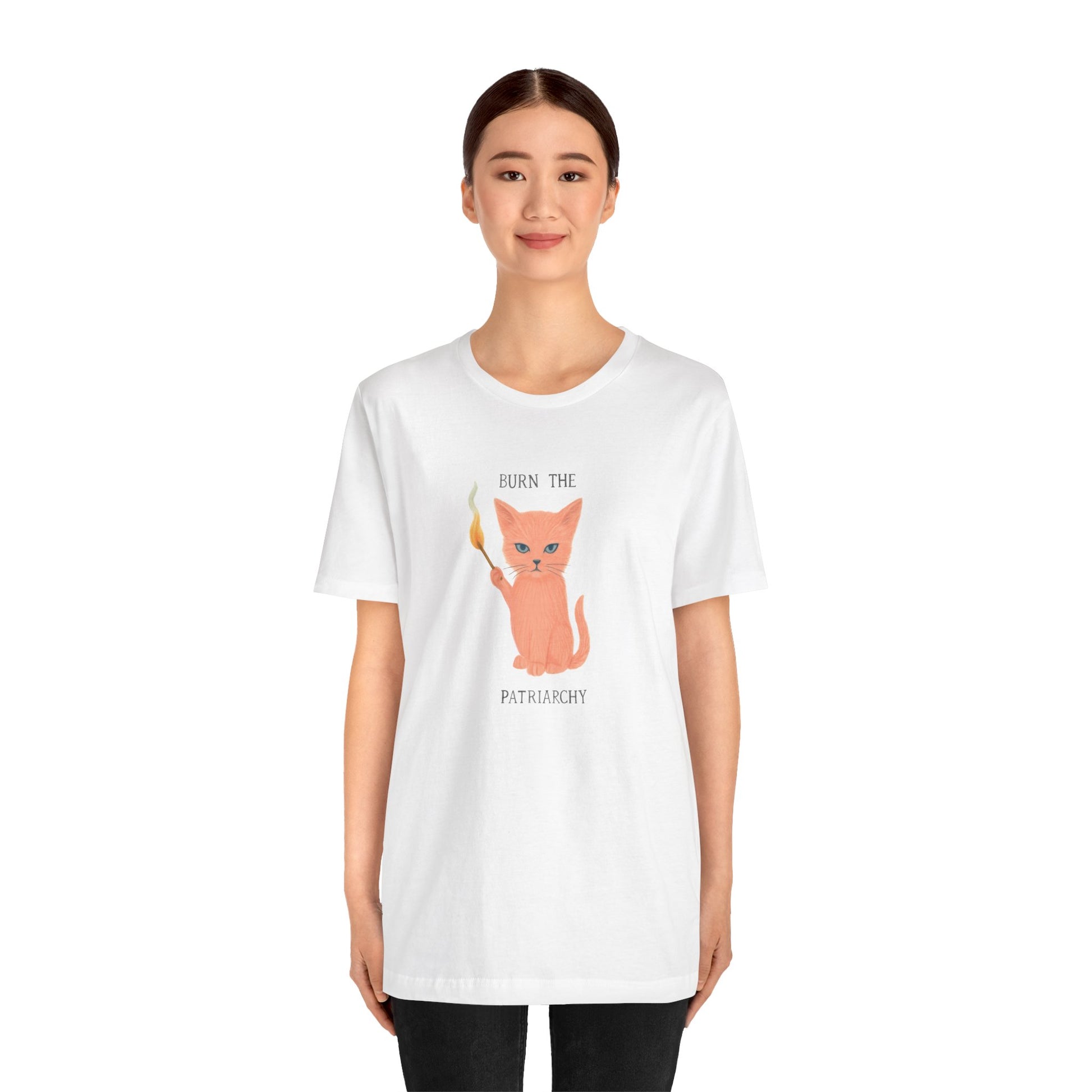 Model wearing Burn the Patriarchy shirt – pink cat holding matchstick